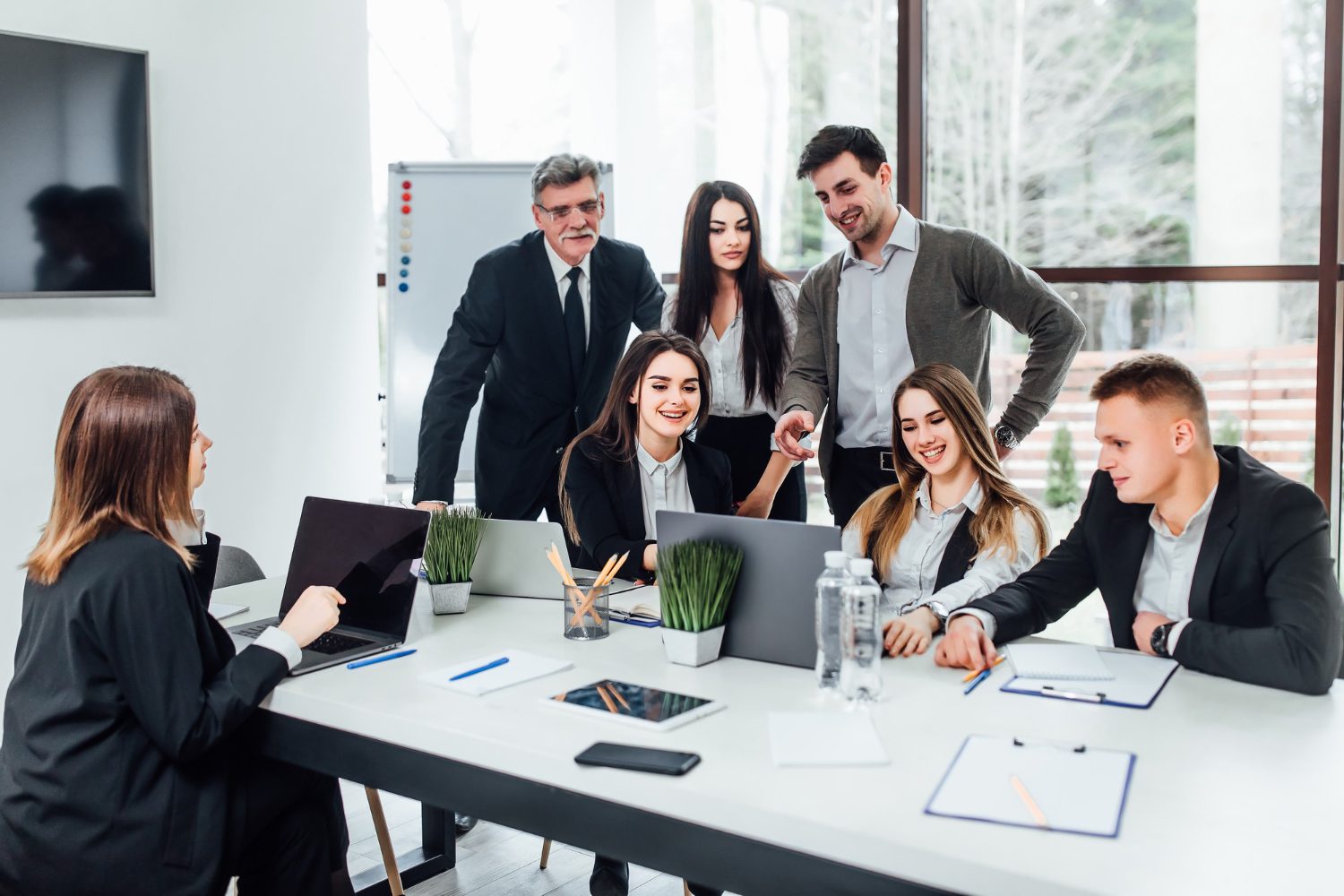 Free photo staff meeting. group of young modern people in smart casual wear discussing something while working in the creative office. business time.<br />
